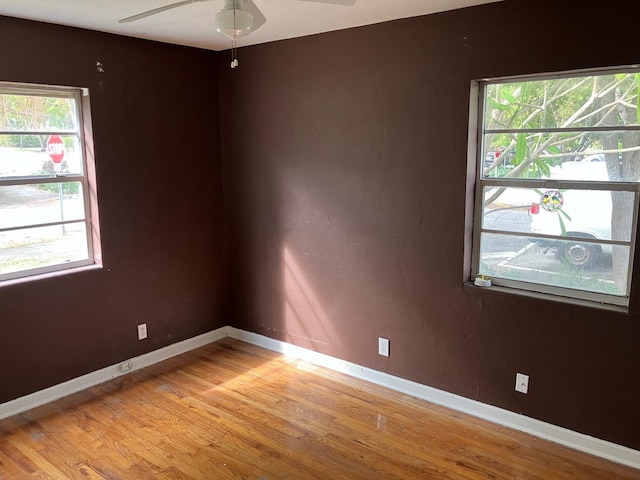 empty room featuring ceiling fan and light hardwood / wood-style floors