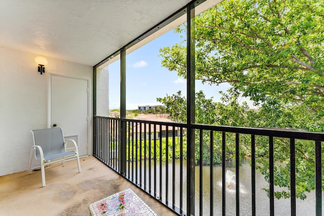 balcony featuring a water view