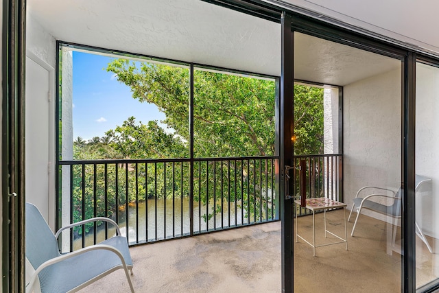 sunroom with a water view