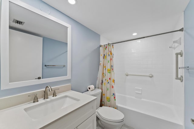 full bathroom featuring shower / tub combo with curtain, vanity, and toilet