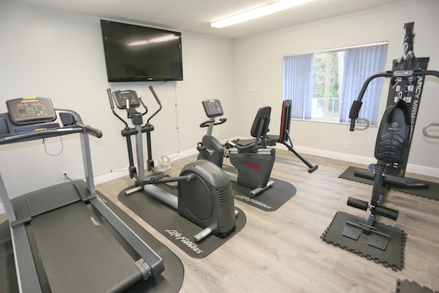 exercise area with light wood-type flooring