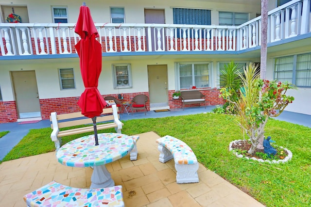 view of patio with a balcony