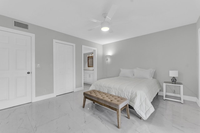 bedroom featuring ceiling fan and ensuite bath