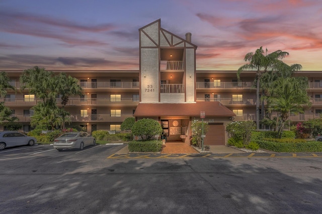 view of outdoor building at dusk