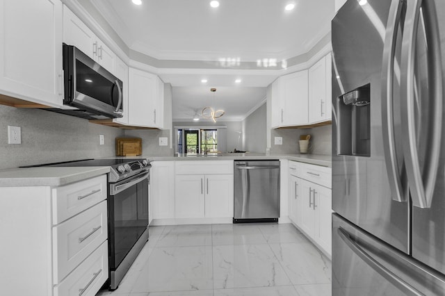 kitchen featuring kitchen peninsula, white cabinets, and stainless steel appliances