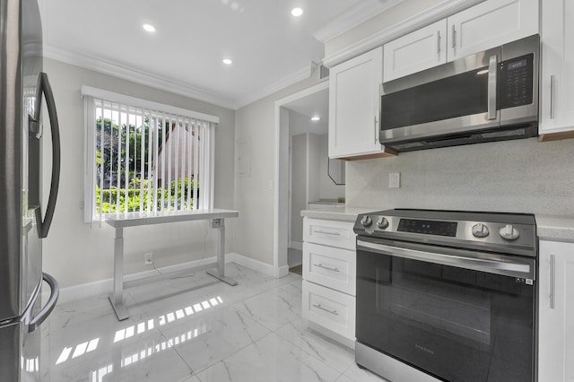 kitchen featuring white cabinets, appliances with stainless steel finishes, tasteful backsplash, and ornamental molding