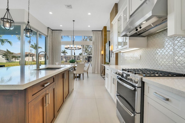 kitchen with white cabinets and appliances with stainless steel finishes