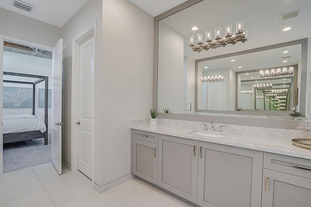 bathroom with tile patterned floors and vanity