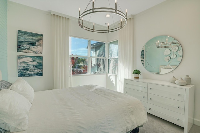 carpeted bedroom with a chandelier