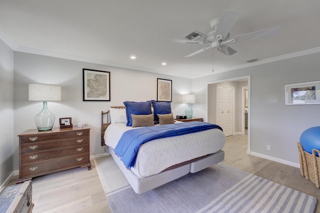 bedroom with crown molding, light hardwood / wood-style floors, and ceiling fan