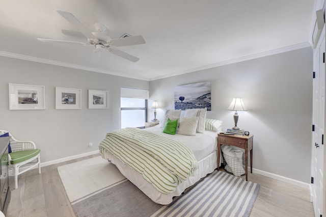 bedroom with ceiling fan, ornamental molding, and light hardwood / wood-style flooring