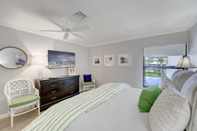 bedroom featuring baseboards, a ceiling fan, visible vents, and crown molding