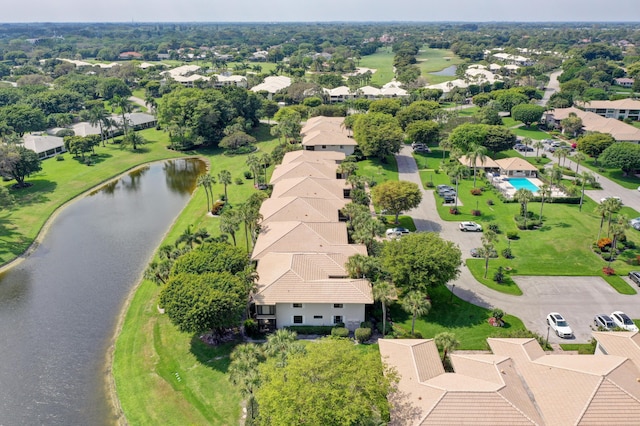 birds eye view of property featuring a water view and a residential view