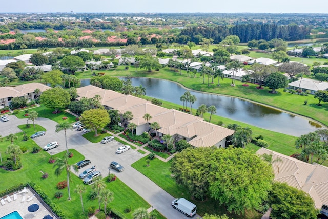 birds eye view of property with a water view and a residential view