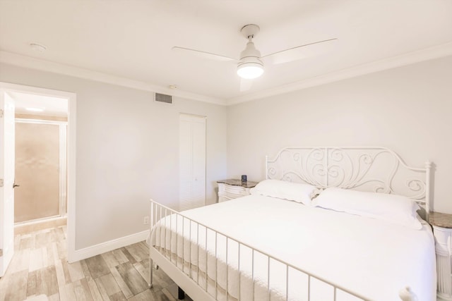 bedroom with visible vents, light wood-style flooring, a ceiling fan, crown molding, and baseboards