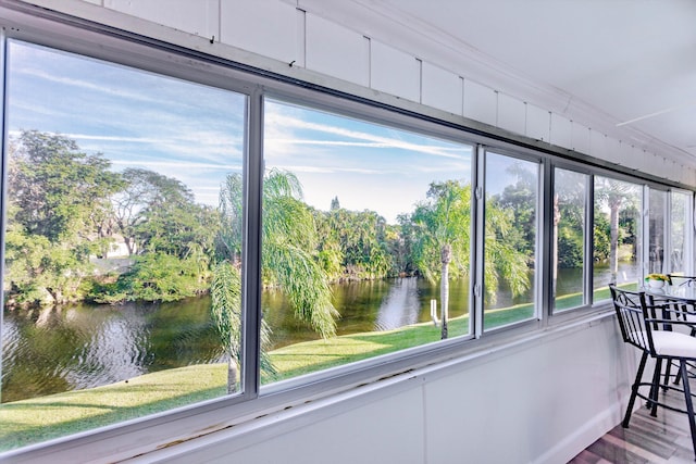 sunroom with a water view