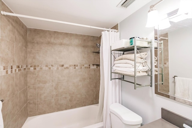 bathroom with visible vents, shower / bath combination with curtain, and toilet