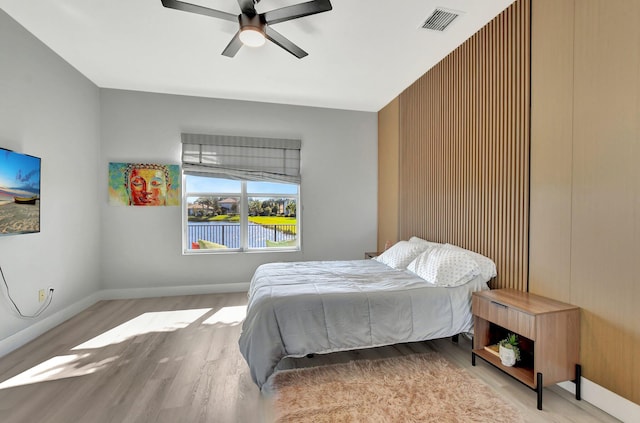 bedroom featuring ceiling fan and light hardwood / wood-style flooring