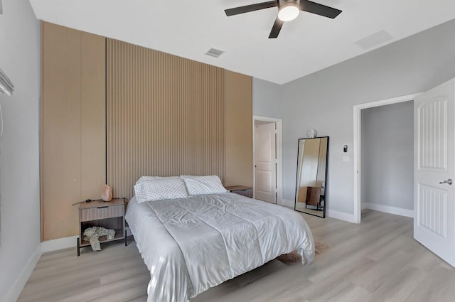 bedroom featuring ceiling fan and light hardwood / wood-style floors