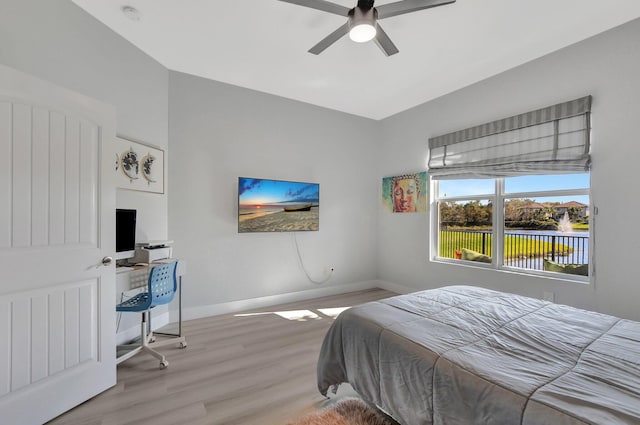 bedroom with ceiling fan and light hardwood / wood-style flooring