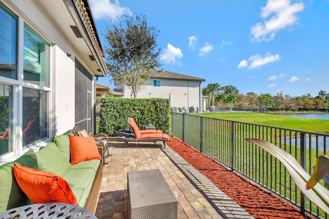 view of patio with a water view