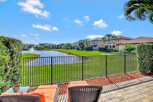 view of patio featuring a water view