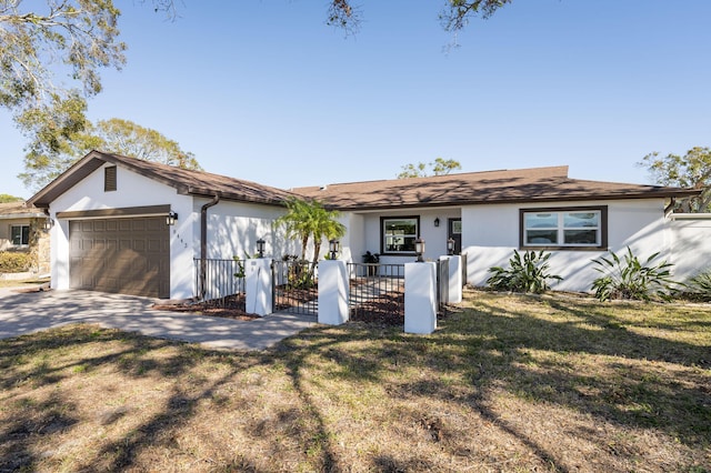 single story home featuring a front lawn and a garage