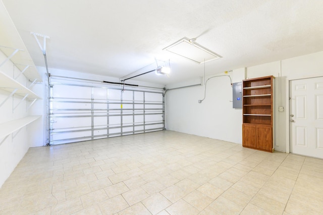 garage featuring a garage door opener and electric panel