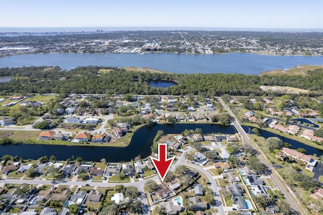 birds eye view of property featuring a water view