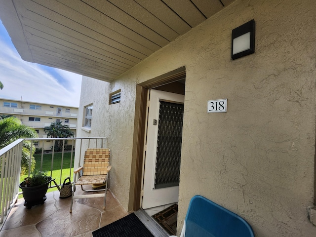 entrance to property with a balcony