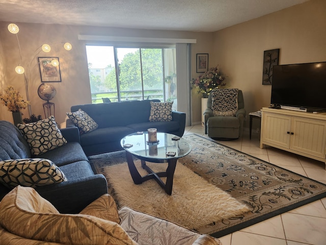 tiled living room featuring a textured ceiling