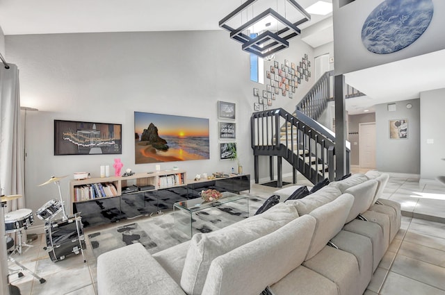 tiled living room featuring a towering ceiling