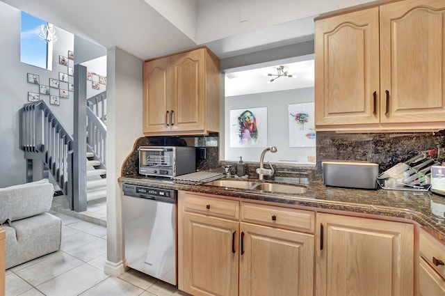 kitchen with sink, dishwasher, light brown cabinets, backsplash, and light tile patterned floors