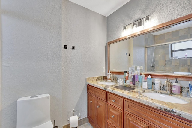 bathroom with vanity, toilet, and an enclosed shower