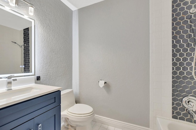 full bathroom with tile patterned floors, vanity, toilet, and tiled shower / bath combo