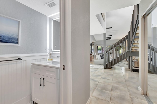 bathroom with vanity and tile patterned floors