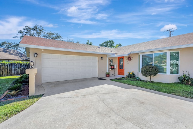 single story home featuring a garage