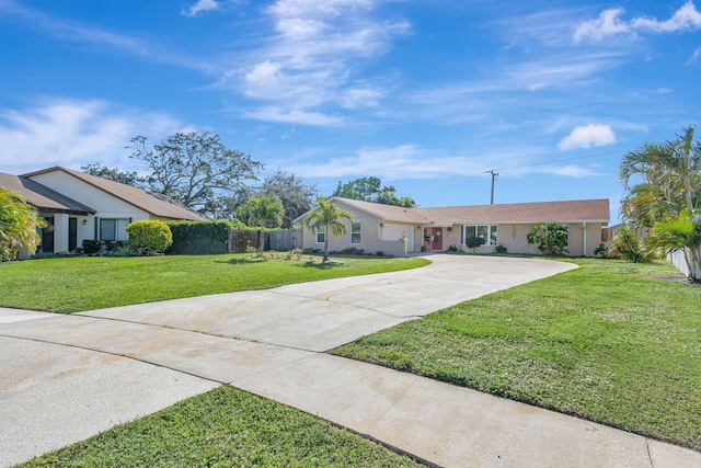 ranch-style home featuring a front yard