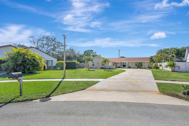 ranch-style home with a front yard