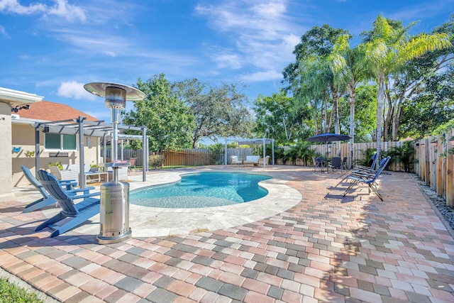 view of swimming pool featuring a pergola and a patio area