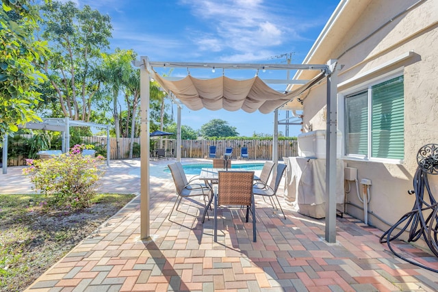 view of patio / terrace featuring a pergola and a fenced in pool