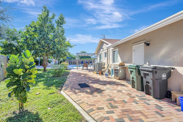 view of patio / terrace featuring a grill and a pergola