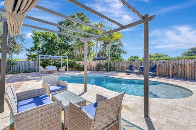 view of pool with a pergola, outdoor lounge area, and a patio