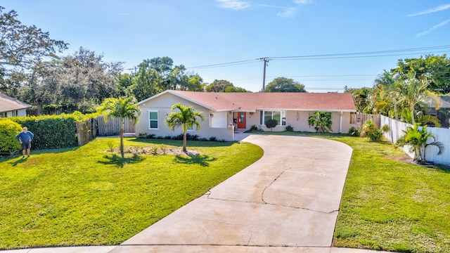 ranch-style home with a front lawn