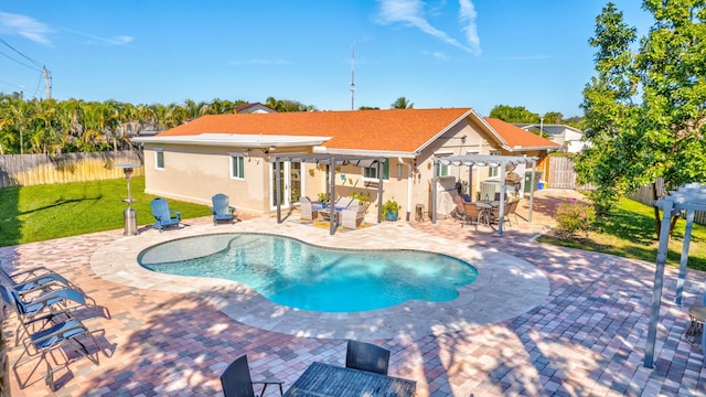 view of pool with an outdoor hangout area, a patio area, a pergola, and a yard