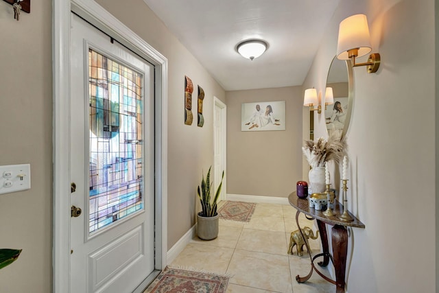 doorway with light tile patterned flooring