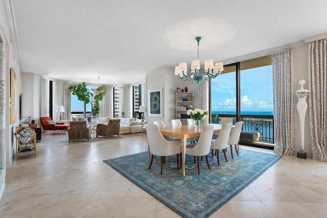 tiled dining space with floor to ceiling windows, a water view, ornamental molding, and an inviting chandelier