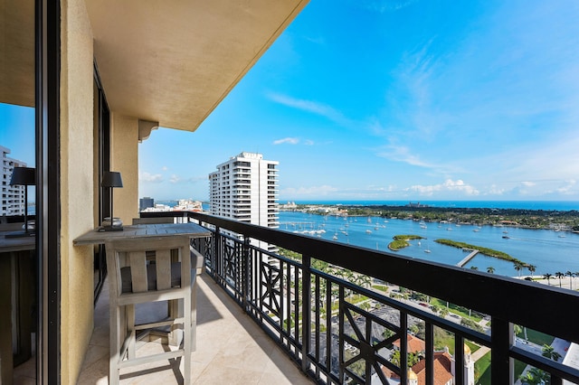 balcony featuring a water view