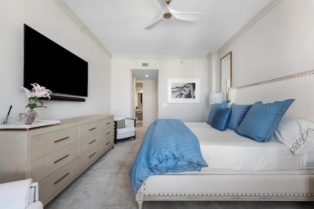 carpeted bedroom featuring ceiling fan and ornamental molding