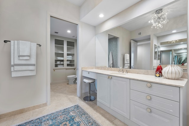 bathroom with tile patterned floors, vanity, and toilet